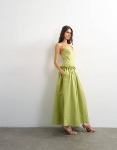 Model wearing Premium cotton maxi dress with raw edge frill detail in green