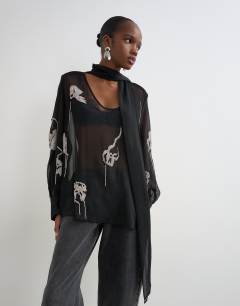 Model wearing Premium embellished chiffon scarf detail top in black