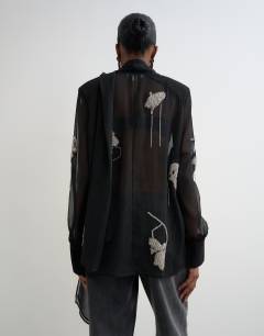 Model wearing Premium embellished chiffon scarf detail top in black
