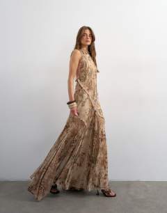 Model wearing Premium embellished high neck open back maxi dress in natural abstract animal print