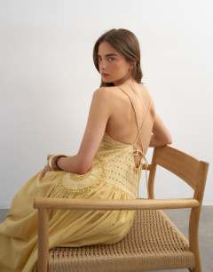 Model wearing Premium embroidered dropped waist maxi sundress in ochre