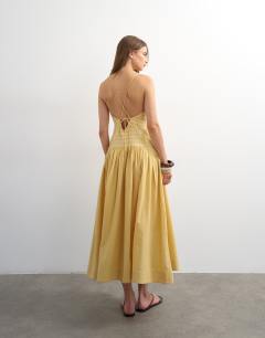 Model wearing Premium embroidered dropped waist maxi sundress in ochre