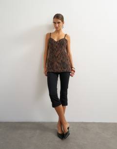 Model wearing Premium faux brushed pony structured peplum cami in animal print