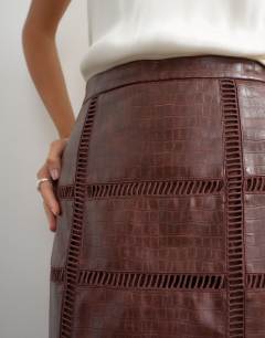 Model wearing Premium faux leather cutwork detail column maxi skirt in chocolate