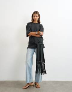 Model wearing Premium fringe tie detail tee in black