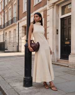 Model wearing Premium funnel neck dropped waist maxi dress in natural woven stripe