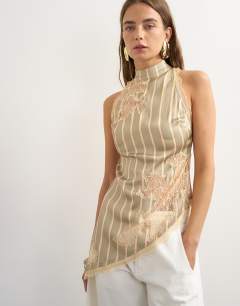 Model wearing Premium halter neck top with contrast lace detail in green stripe