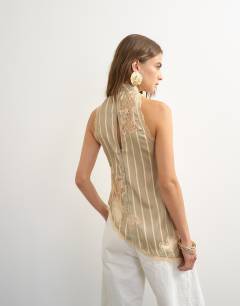 Model wearing Premium halter neck top with contrast lace detail in green stripe