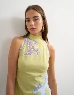 Model wearing Premium halter neck top with contrast lace detail in green 