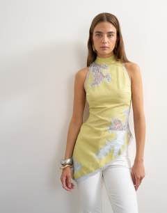 Model wearing Premium halter neck top with contrast lace detail in green 