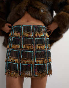 Model wearing Premium heavily embellished fringed mini skirt in blue and black