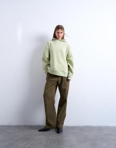 Model wearing Premium heavyweight oversized hoodie in light green