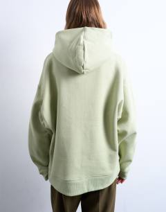 Model wearing Premium heavyweight oversized hoodie in light green