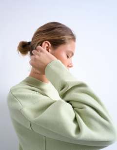 Model wearing Premium heavyweight oversized sweat in light green