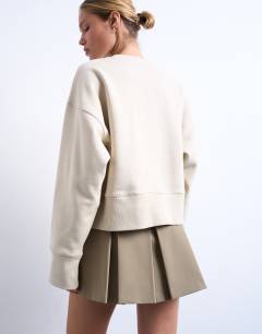 Model wearing Premium heavyweight oversized sweat in sand