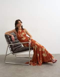 Model wearing Premium high neck open back maxi dress in spaced orange floral