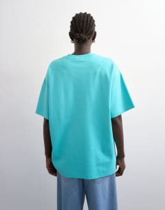Model wearing Premium interlock oversized tee in light blue