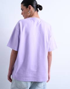 Model wearing Premium interlock oversized tee in lilac