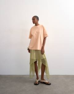 Model wearing Premium interlock oversized tee in peach