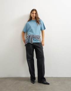 Model wearing Premium interlock t-shirt in blue