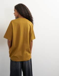 Model wearing Premium interlock t-shirt in ochre