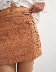 Model wearing Premium jacquard embellished mini skirt