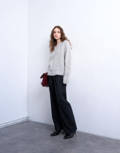 Model wearing Premium knitted fluffy v-neck alpaca jumper in light grey