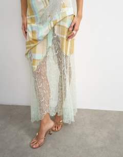 Model wearing Premium linen blend halter neck lace hem occasion maxi dress in check