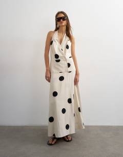 Model wearing Premium linen rich halter neck wrap maxi dress in natural mono polka dot