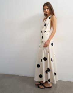Model wearing Premium linen rich halter neck wrap maxi dress in natural mono polka dot