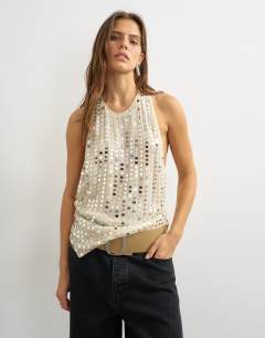 Model wearing Premium low scoop open back tank top with heavy silver embellishment in off white