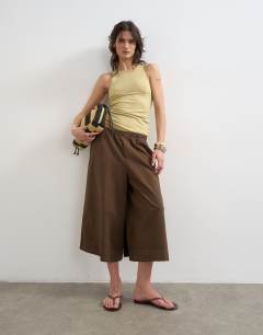 Model wearing Premium lyocell blend soft rib racer vest in soft khaki