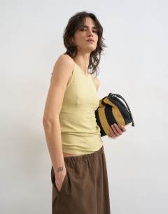 Model wearing Premium lyocell blend soft rib racer vest in soft khaki