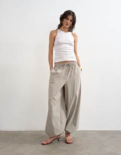 Model wearing Premium lyocell blend soft rib racer vest in white