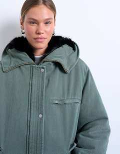 Model wearing Premium oversized parka with fur hood in khaki