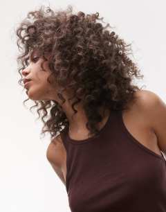 Model wearing Premium racer vest in chocolate