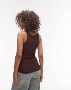 Model wearing Premium racer vest in chocolate