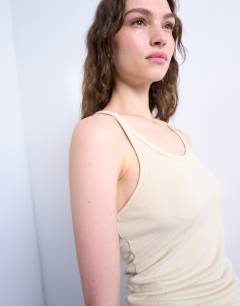 Model wearing Premium racer vest in ivory