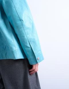 Model wearing Premium real leather jacket in turquoise