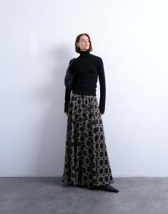 Model wearing Premium rib funnel neck top in black