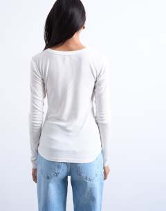 Model wearing Premium rib long sleeve wide scoop neck top in ecru
