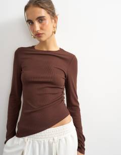 Model wearing Premium rib ruched asymmetric hem long sleeve top in chocolate