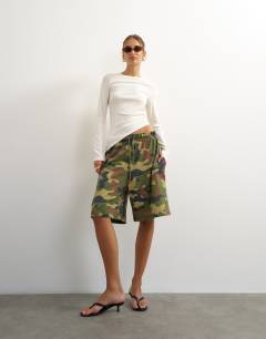 Model wearing Premium rib ruched asymmetric hem long sleeve top in white