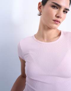 Model wearing Premium rib short sleeve tee in pink
