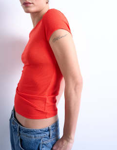 Model wearing Premium rib short sleeve tee in red