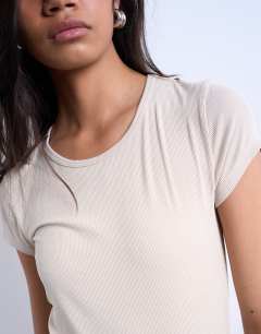 Model wearing Premium rib short sleeve tee in stone