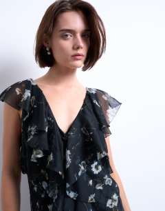 Model wearing Premium ruffle pintuck gown in falling lilac flowers