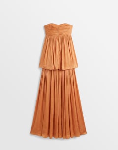 Model wearing Premium satin dropped waist bandeau maxi dress in orange