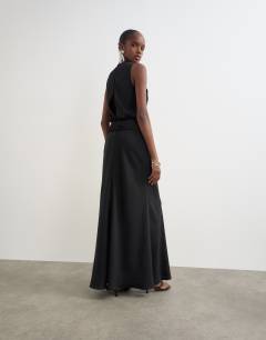 Model wearing Premium satin dropped waist sash detail maxi dress in black with contrast top stitching
