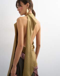 Model wearing Premium satin halter asymmetric mini dress with scarf detail in geo scarf print